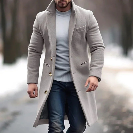 Man wearing stylish beige overcoat and jeans walking outdoors in winter, Auretier fashion