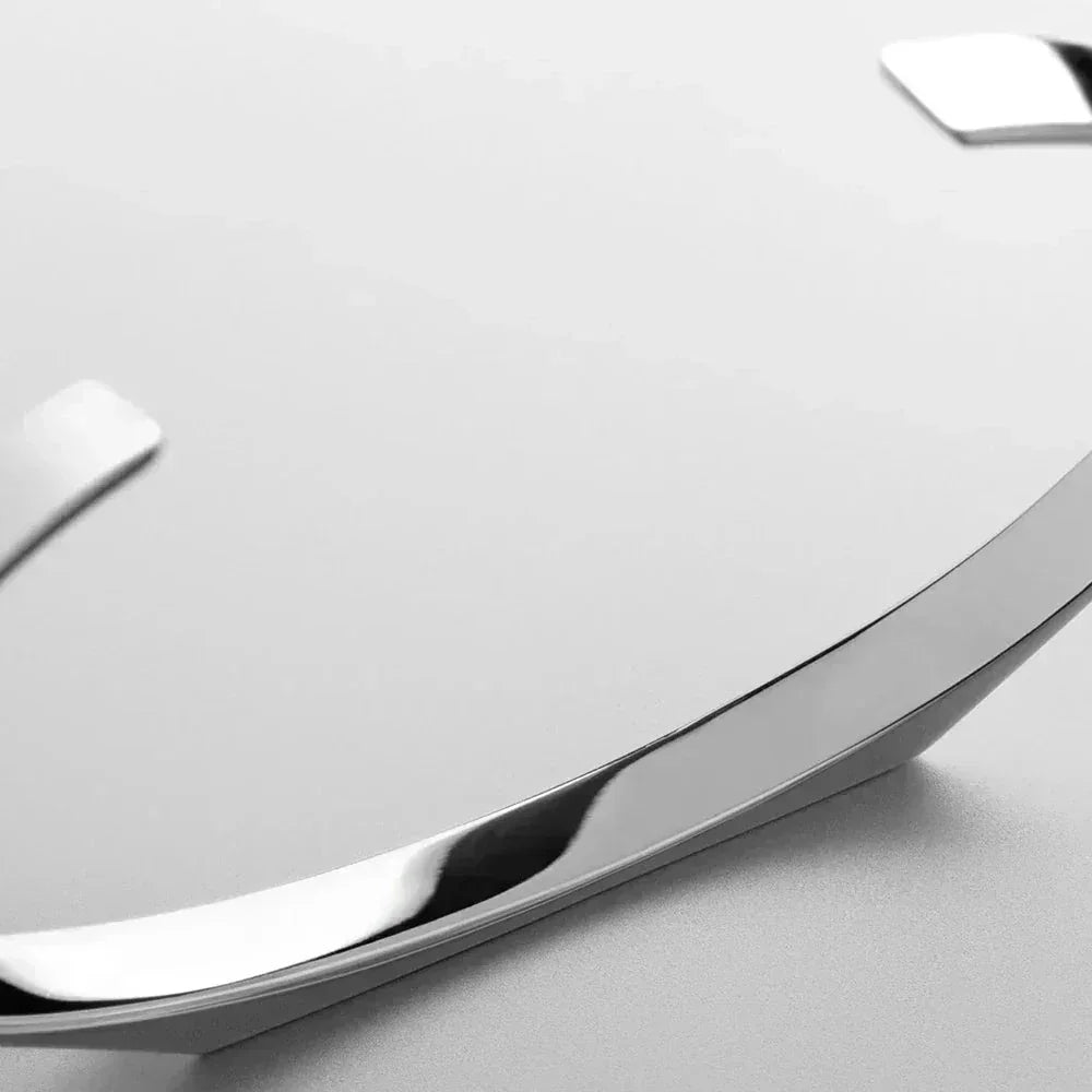 Close-up of a polished silver bracelet with a sleek design on a light background, Auretier jewelry