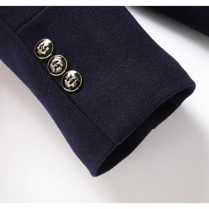 Navy overcoat sleeve with three gold decorative buttons, Auretier fashion detail