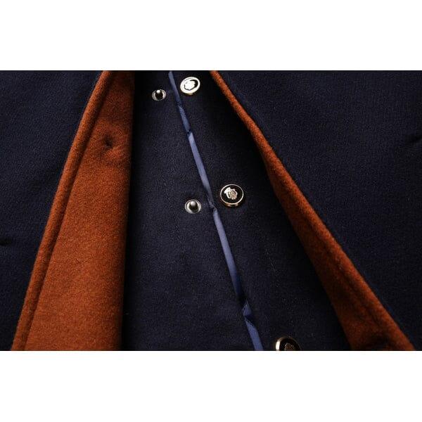 Close-up of a navy and brown wool overcoat with button details from Auretier