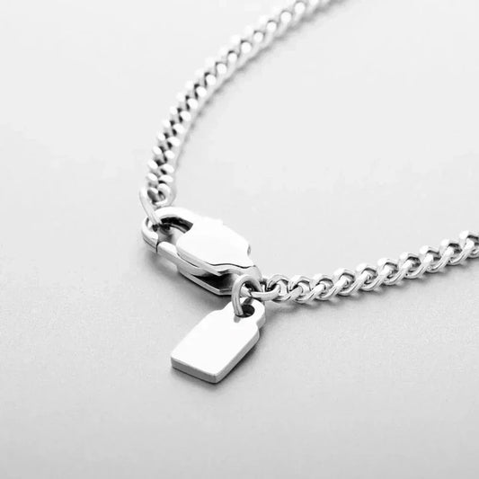 Auretier Genova necklace with silver chain and rectangular pendant on light background