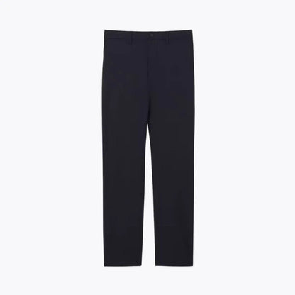 Slim fit stretch commuter pants in navy blue from Auretier on a plain background
