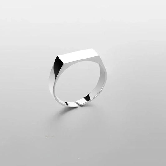 Minimalist silver geometric ring on light background, Auretier modern jewelry design