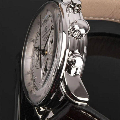 Close-up of a men's luxury wristwatch with silver dial and leather strap from Auretier.