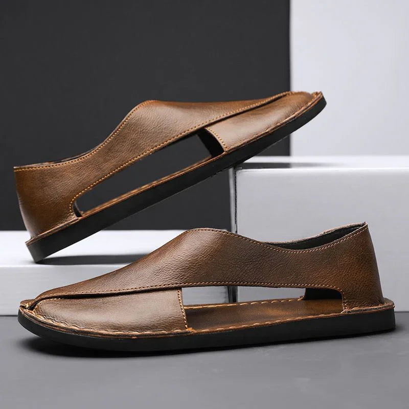 Brown leather sandals with cutout sides, flat soles, displayed on a modern background