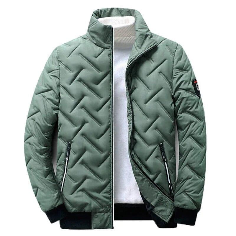 Green quilted urban style transition jacket with zipper pockets, displayed on white top