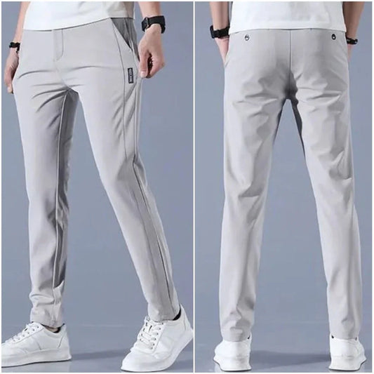Front and back view of slim fit light gray golf pants for men, styled with white sneakers